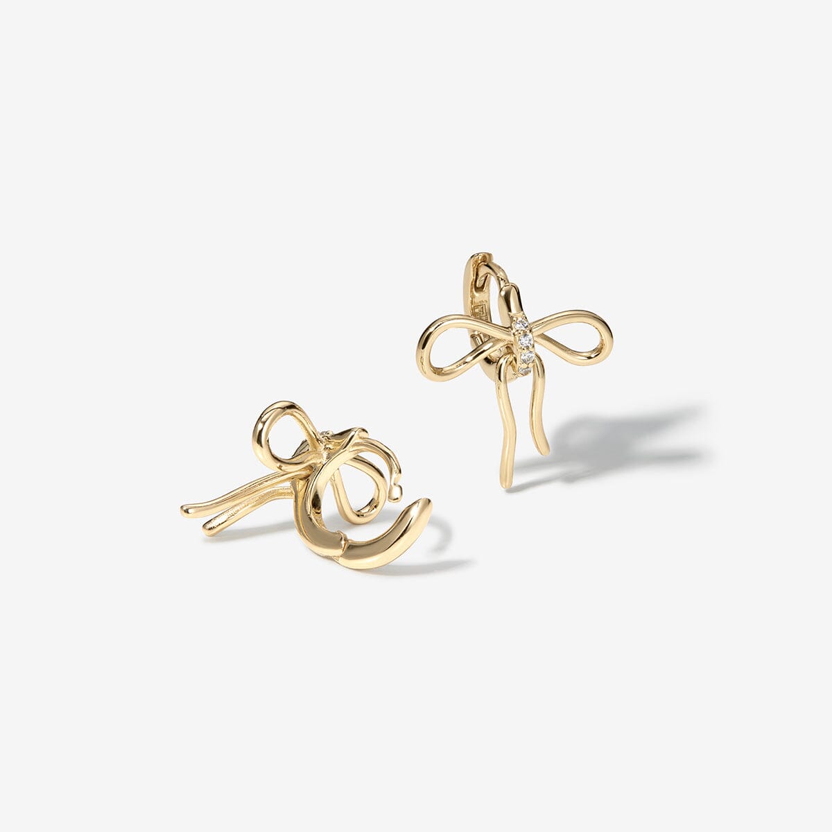 Cliff bow huggie earrings